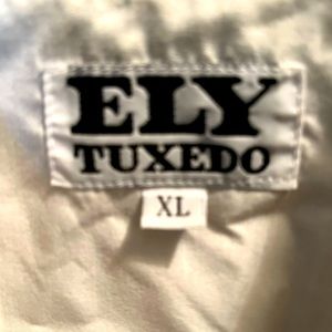 White tuxedo shirt with black snaps.